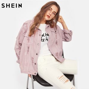 Trendy pink lapel boyfriend denim jacket with ripped details and single-breasted closure. 