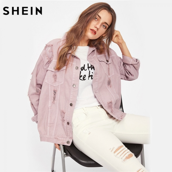 Trendy pink lapel boyfriend denim jacket with ripped details and single-breasted closure. 
