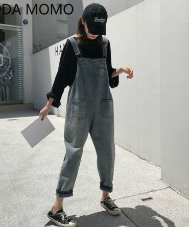 VODA MOMO Girls’ Sleeveless Denim Jumpsuit in vintage bleached wash with loose fit, pockets, and zipper fly closure. 