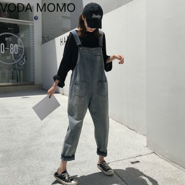Women Clothing Sleeveless Denim Jumpsuit Women Overalls Jumpsuits loose Suspenders Jeans Women Overalls Female Rompers jeans VODA MOMO Girls’ Sleeveless Denim Jumpsuit in vintage bleached wash with loose fit, pockets, and zipper fly closure.