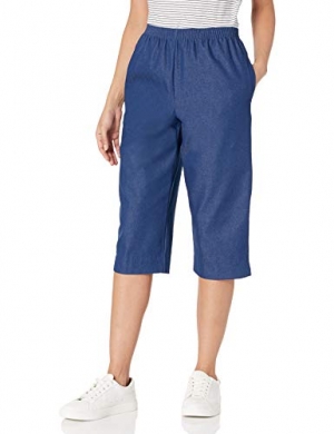 A pair of Alfred Dunner ladies’ petite denim capris featuring a classic elastic waistband and soft cotton fabric, styled casually with a light top in a cozy outdoor setting. 